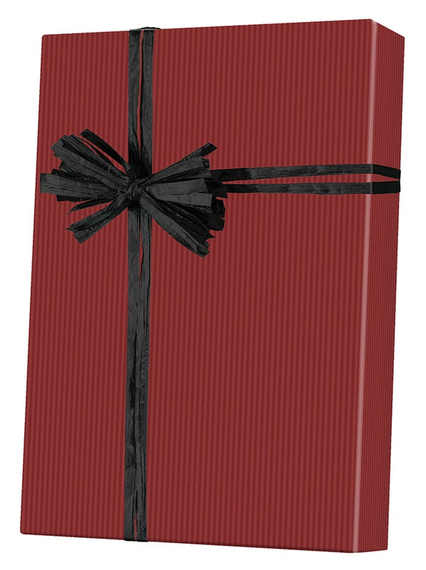 Gift box wrapped in craft paper with a note in the form of a red